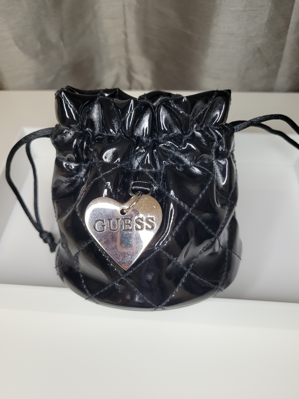 Guess Black Quilted Patent Drawstring Pouch with Heart Charm